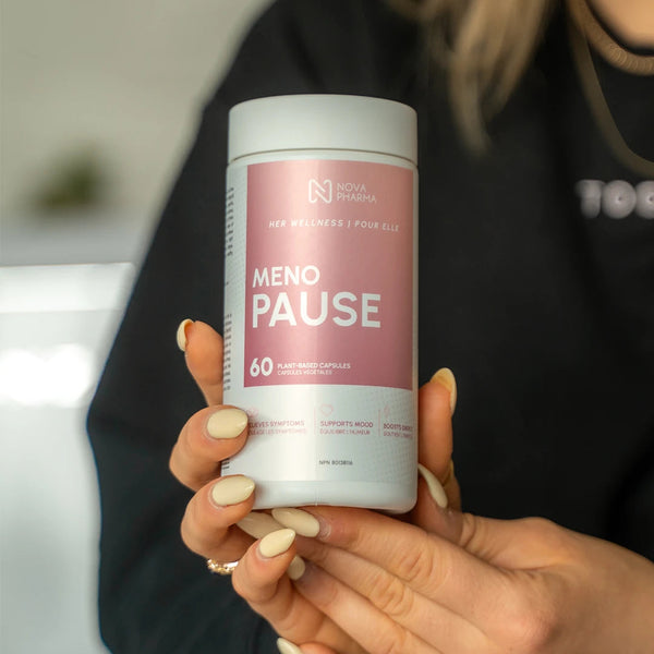 Person holding a 'Meno Pause' supplement container with visible pills.
